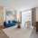 living room couch, chair  and table by the window Rivermark Northern Liberties Philadelphia PA luxury apartments 