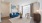 living room couch, chair  and table by the window Rivermark Northern Liberties Philadelphia PA luxury apartments 