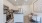 kitchen appliances and island next to dining table and chairs  Rivermark Northern Liberties Philadelphia PA luxury apartments 