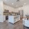 kitchen appliances and island next to dining table and chairs  Rivermark Northern Liberties Philadelphia PA luxury apartments 