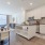 kitchen appliances and island next to dining table and chairs  Rivermark Northern Liberties Philadelphia PA luxury apartments 