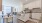kitchen appliances and island next to dining table and chairs  Rivermark Northern Liberties Philadelphia PA luxury apartments 