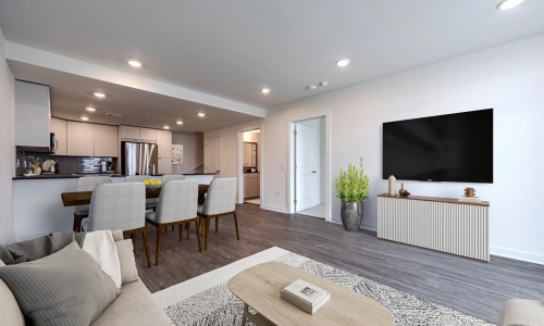 Open space living area with tv and dining table - Rivermark Northern Liberties 2 and 3 bedroom townhomes for rent Philadelphia PA