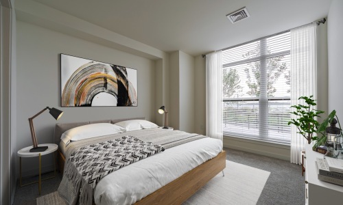 Bedroom with floor to ceiling windows bringing in natural light - Rivermark Northern Liberties townhomes for rent in Philadelphia