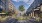 a street in between buildings with trees tables and chairs Rivermark luxury apts Philadelphia PA Northern Liberties  