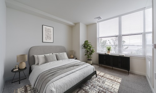Bedroom with oversized windows and ample natural lighting  - Rivermark Northern Liberties townhomes for rent in Philadelphia