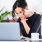 A woman working in co-working space at Rivermark Northern Liberties Apartments