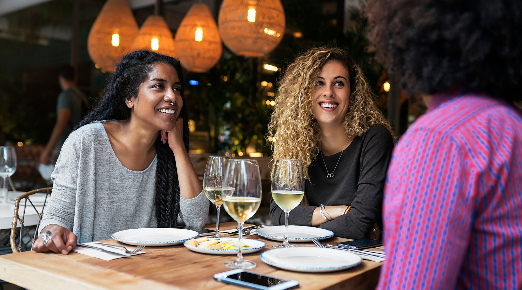 three people at a restaurant Rivermark apartments Philadelphia PA Northern Liberties  