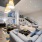 lobby lounge area with tables and chairs by staircase  Rivermark Northern Liberties Philadelphia PA luxury apartments for rent