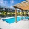 pool with lounge chairs next to building  Rivermark Northern Liberties waterfront apartments Philadelphia PA