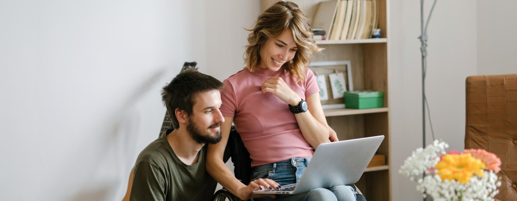 a man and a woman sitting in front of a laptop Rivermark Northern Liberties Philly apartments 