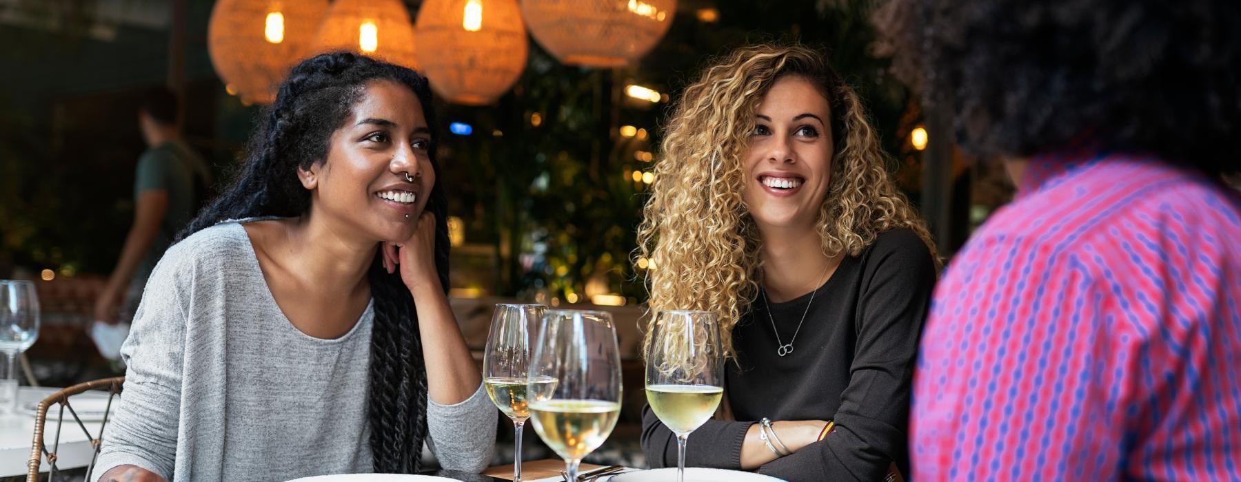 women sitting at a table with wine glasses Rivermark apartments Philadelphia PA Northern Liberties  