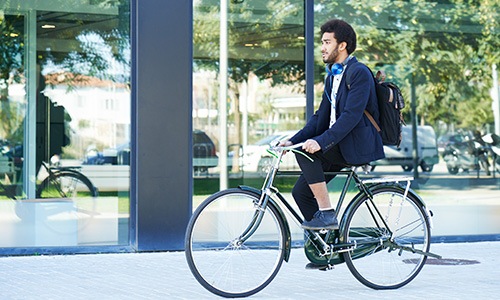 a person riding a bicycle in a suit Rivermark apartments Philadelphia PA Northern Liberties  