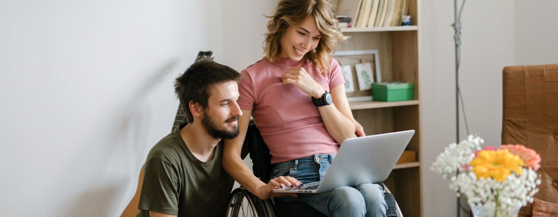 2 people looking at laptop - what are the best luxury apartments on the waterfront Philly Rivermark Northern Liberties